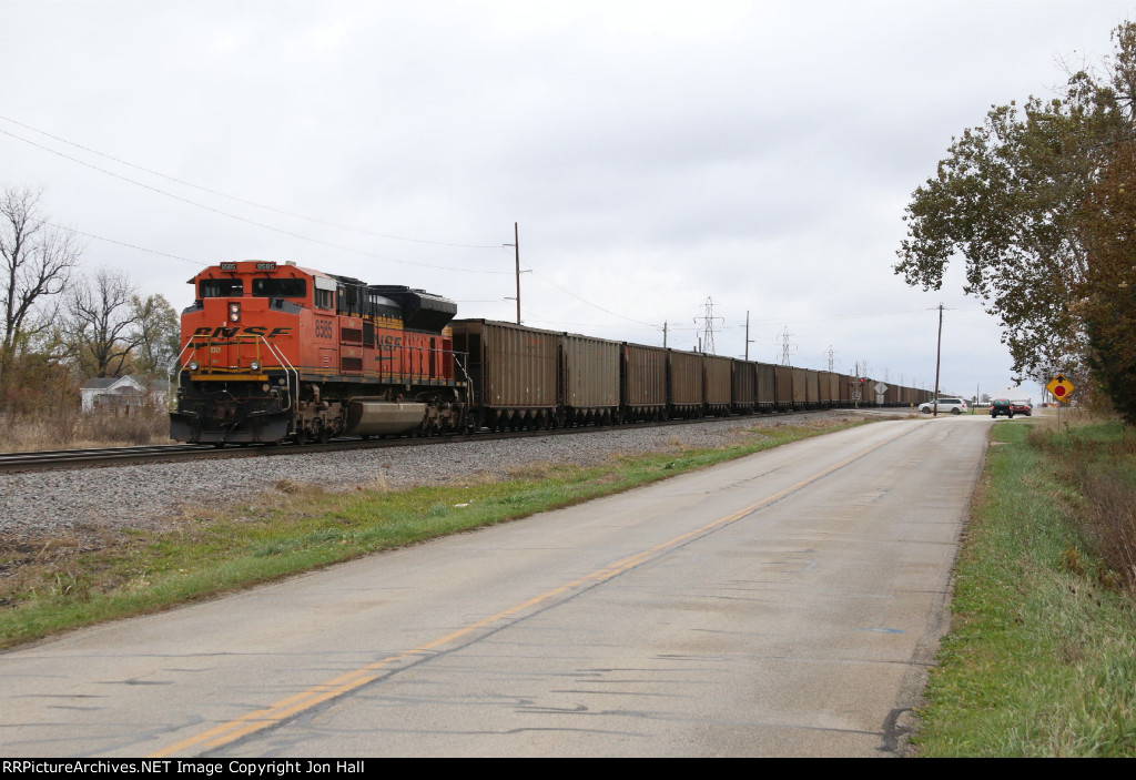 C-BKMPCL heads away with a solid train of bottom dump hoppers